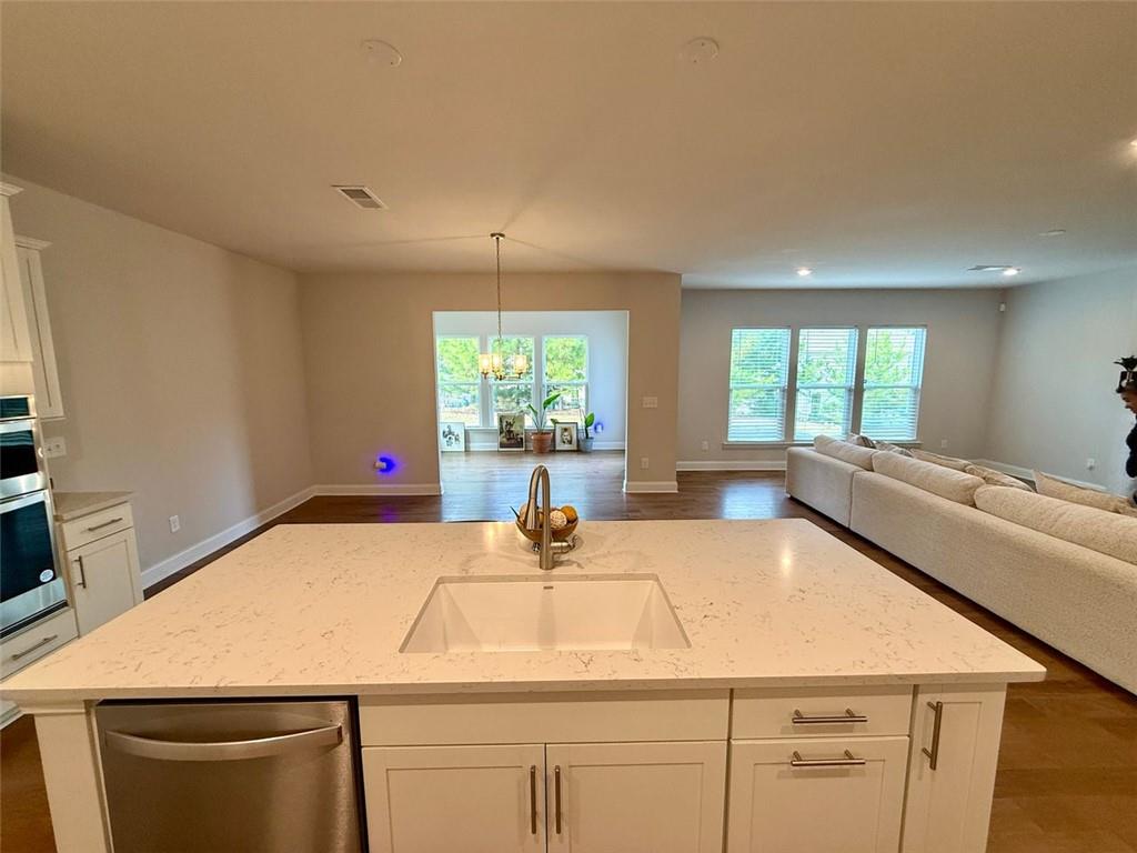 26 Riverclub Road Acworth, GA 30101 - Photo 35 of 73 a kitchen with a stove a sink and a window