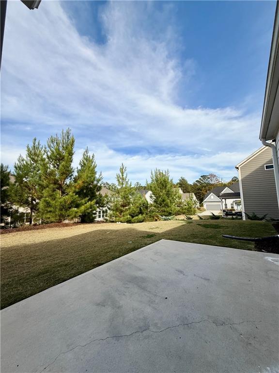26 Riverclub Road Acworth, GA 30101 - Photo 40 of 73 a view of a yard with an ocean and trees