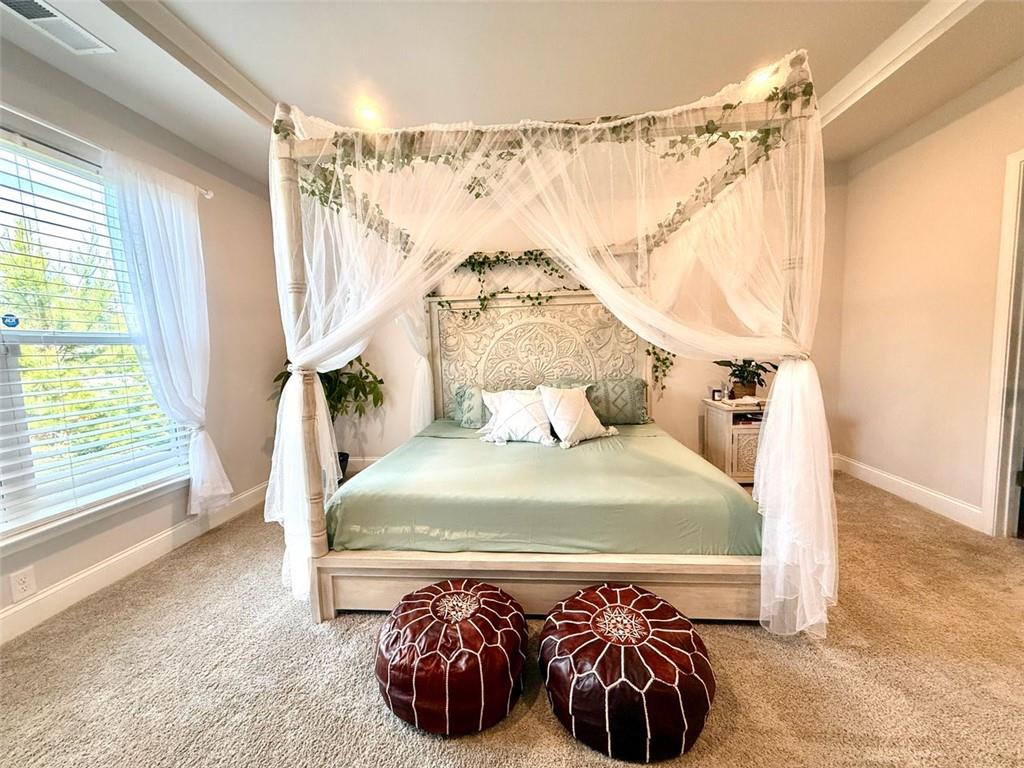 26 Riverclub Road Acworth, GA 30101 - Photo 43 of 73 a bed sitting in a bedroom next to a window