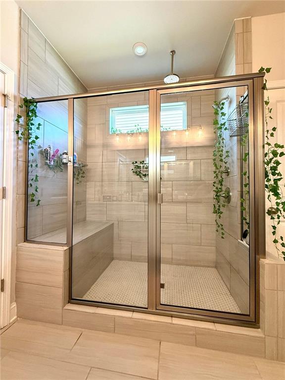 26 Riverclub Road Acworth, GA 30101 - Photo 49 of 73 a bathroom with a glass shower door