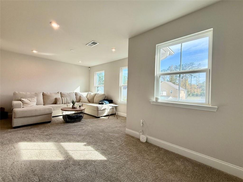26 Riverclub Road Acworth, GA 30101 - Photo 60 of 73 a living room with furniture and a window