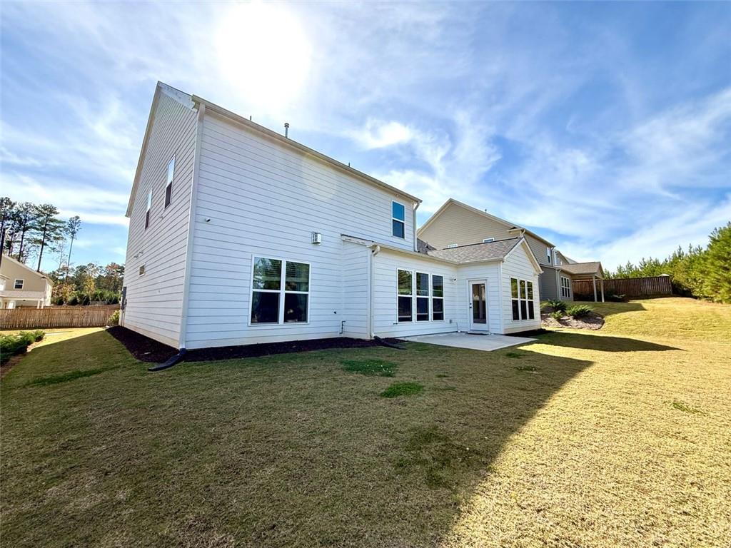 26 Riverclub Road Acworth, GA 30101 - Photo 6 of 73 a view of a house with a yard and large tree