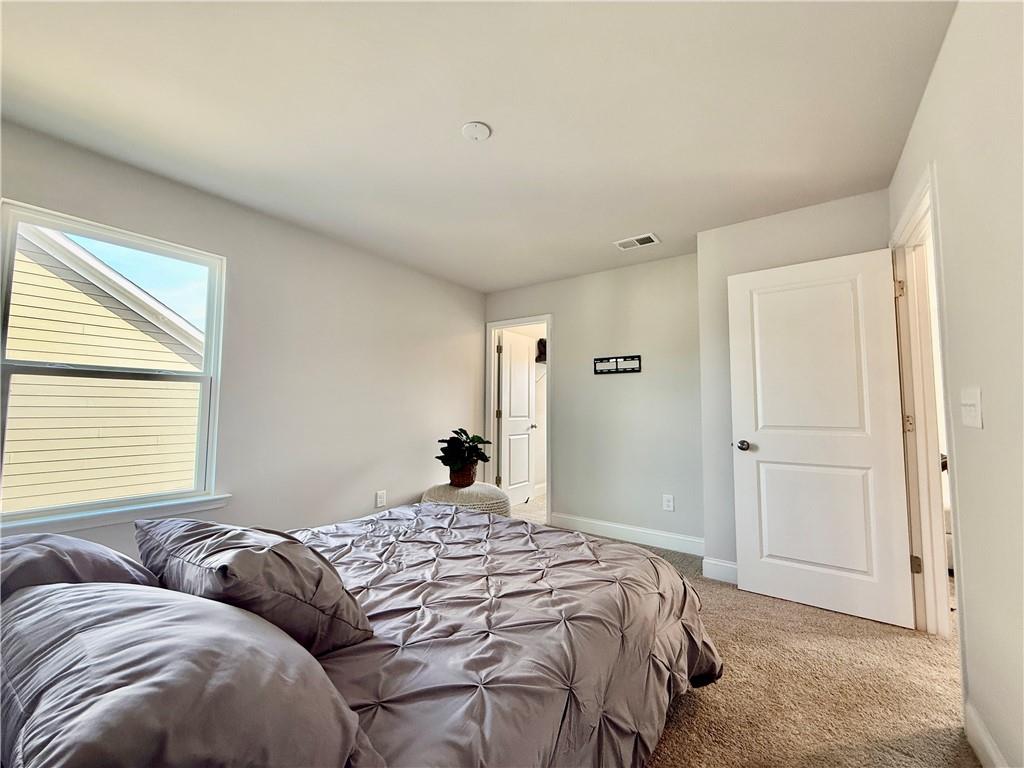26 Riverclub Road Acworth, GA 30101 - Photo 63 of 73 a bedroom with a bed and a window