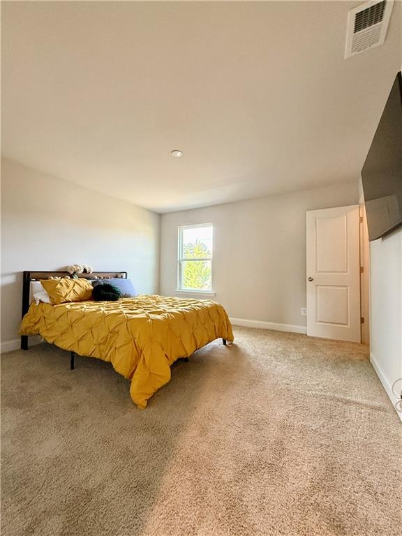 26 Riverclub Road Acworth, GA 30101 - Photo 65 of 73 a bed sitting in a bedroom next to a window