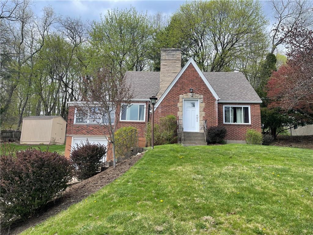 1815 Sample Road Allison Park, PA 15101 - Photo 1 of 40 a front view of a house with a yard and trees