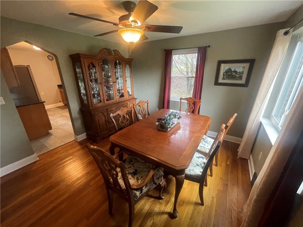 1815 Sample Road Allison Park, PA 15101 - Photo 15 of 40 a view of a dining room with furniture and wooden floor