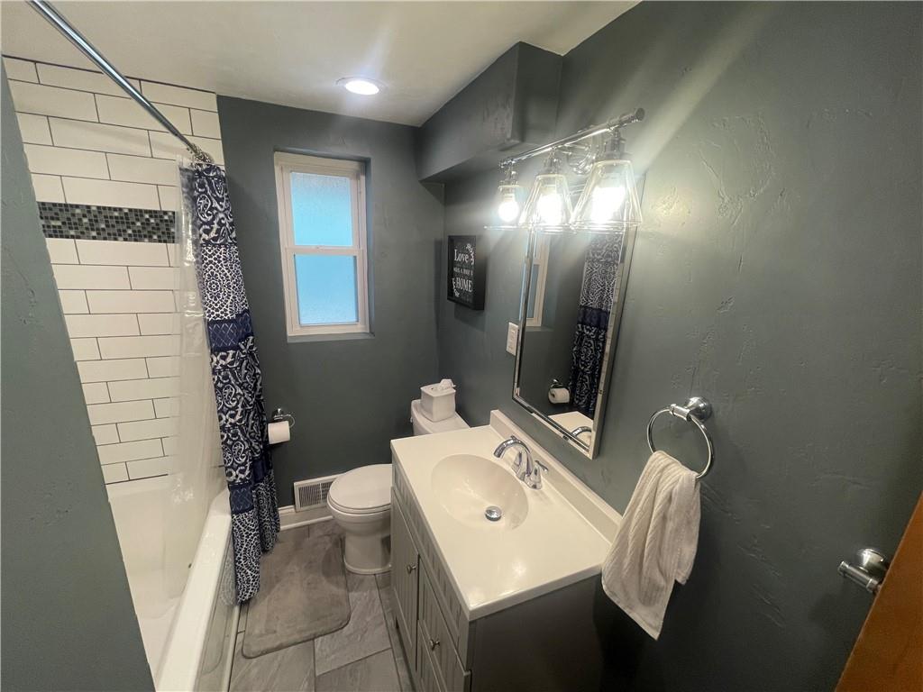 1815 Sample Road Allison Park, PA 15101 - Photo 19 of 40 a bathroom with a sink a toilet and shower