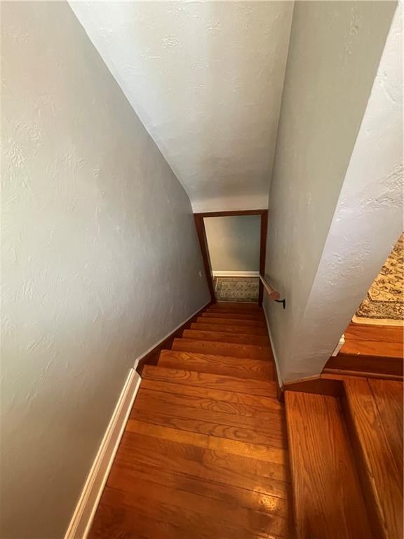 1815 Sample Road Allison Park, PA 15101 - Photo 22 of 40 a view of a room with wooden floor and staircase