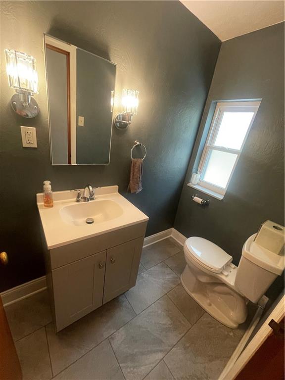 1815 Sample Road Allison Park, PA 15101 - Photo 28 of 40 a bathroom with a toilet sink and mirror