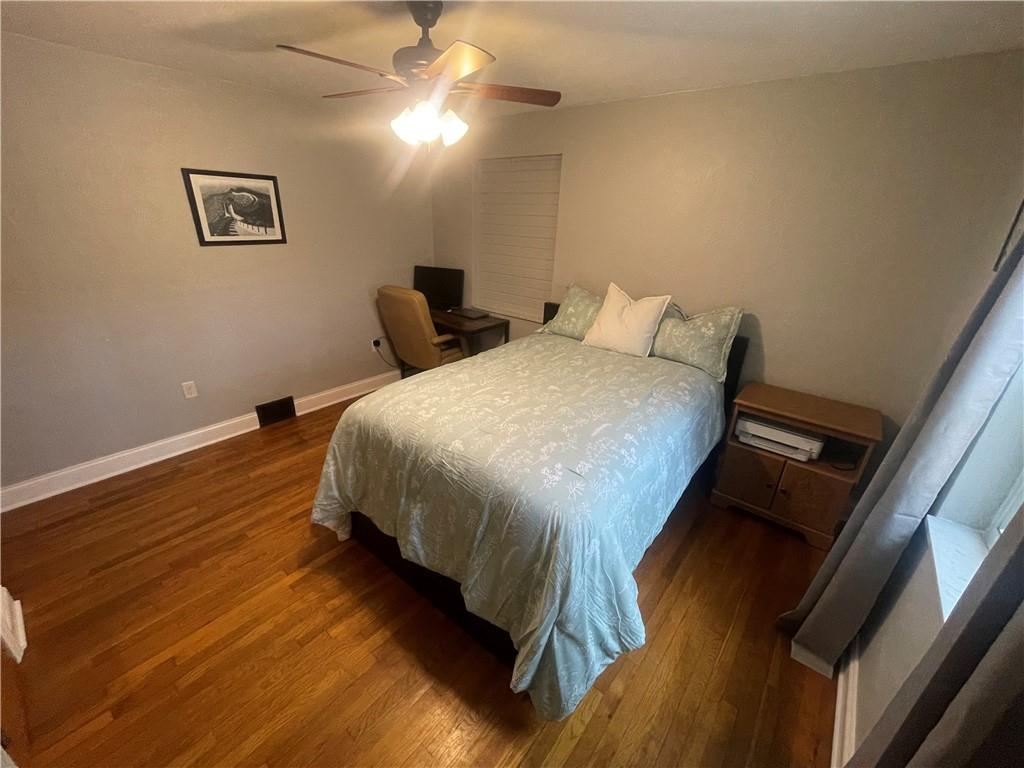 1815 Sample Road Allison Park, PA 15101 - Photo 29 of 40 a bed sitting in a bedroom next to a lamp