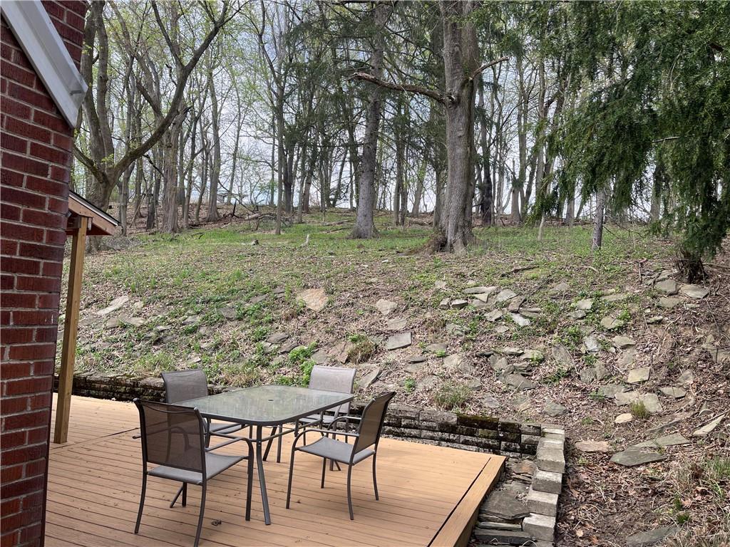 1815 Sample Road Allison Park, PA 15101 - Photo 6 of 40 a backyard of a house with table and chairs