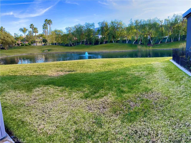a view of a lake with houses in the background
