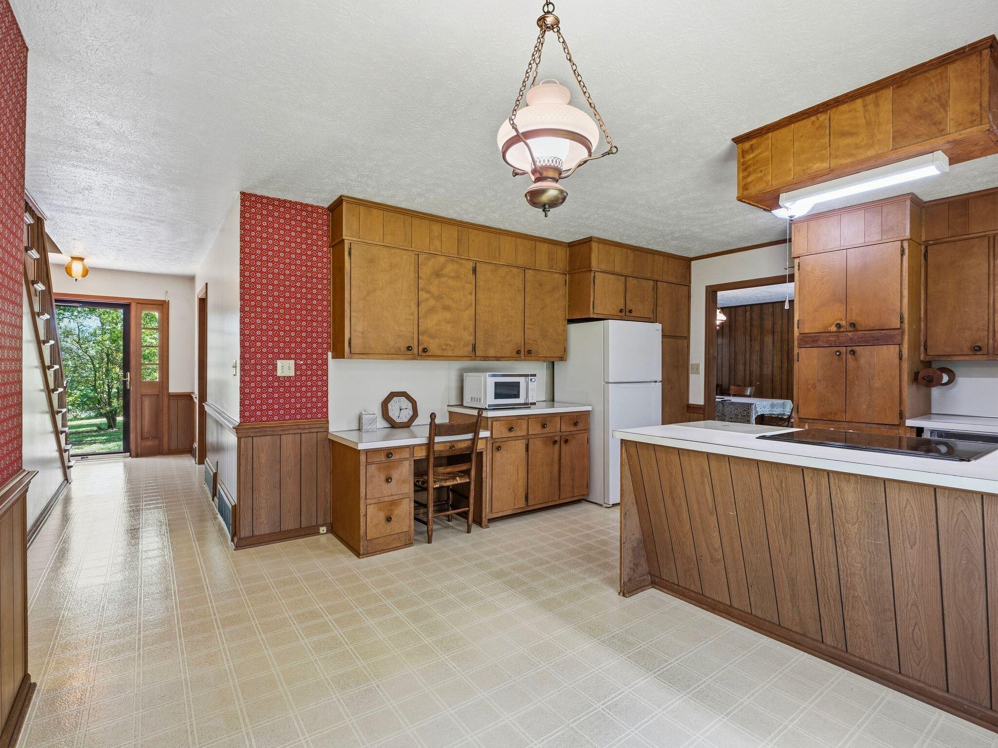 1115 Robin Ridge Road Henry, VA 24102 - Photo 6 of 54 a view of a kitchen with a sink cabinets and window