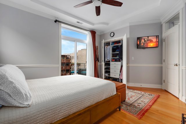 4730 North Malden Street, Unit 3 Chicago, IL 60640 - Photo 12 of 25 a bedroom with a large bed and a window