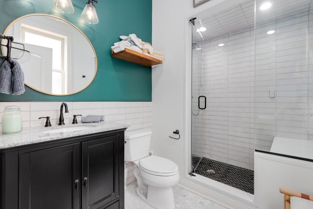 4730 North Malden Street, Unit 3 Chicago, IL 60640 - Photo 15 of 25 a bathroom with a toilet a sink and mirror