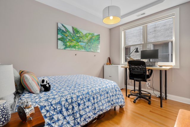 4730 North Malden Street, Unit 3 Chicago, IL 60640 - Photo 16 of 25 a bedroom with a bed and a window