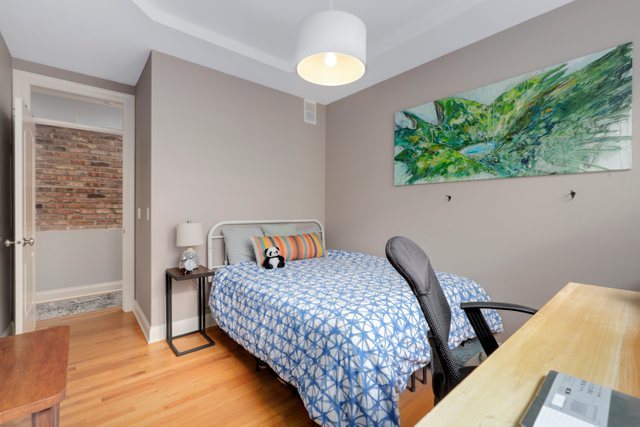 4730 North Malden Street, Unit 3 Chicago, IL 60640 - Photo 17 of 25 a bedroom with a bed and a window