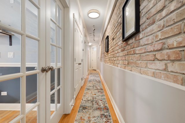 4730 North Malden Street, Unit 3 Chicago, IL 60640 - Photo 21 of 25 a view of a hallway with wooden floor and staircase