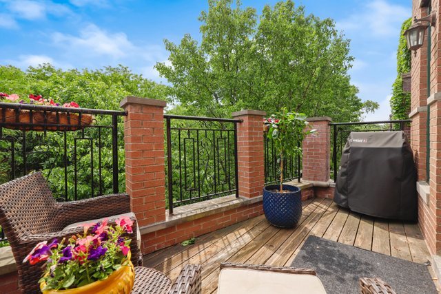 4730 North Malden Street, Unit 3 Chicago, IL 60640 - Photo 24 of 25 a view of a chair and tables in the backyard