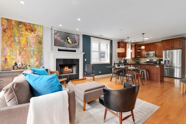 4730 North Malden Street, Unit 3 Chicago, IL 60640 - Photo 8 of 25 a living room with furniture and a fireplace