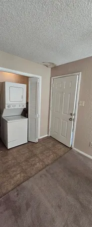 a view of a big room with a cabinet and a mirror