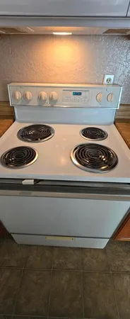 a close view of stove top oven with stove