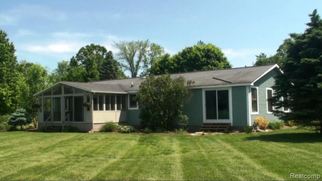 2136 Granger Road Oxford, MI 48371 - Photo 6 of 95 20 ft x 11 ft florida room off the kitchen to watch the sunrise and sunset. 220 sqft not included in total sq ftg