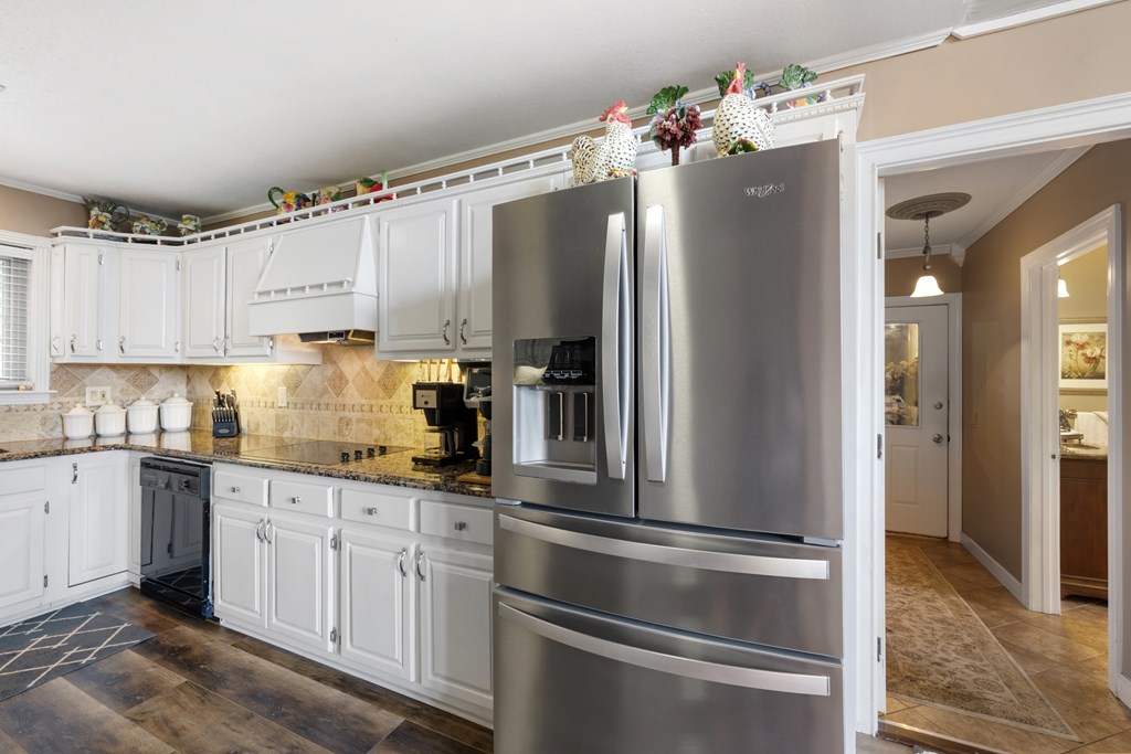 1396 Deerfield Road Young Harris, GA 30582 - Photo 16 of 60 a kitchen with stainless steel appliances a refrigerator sink and cabinets