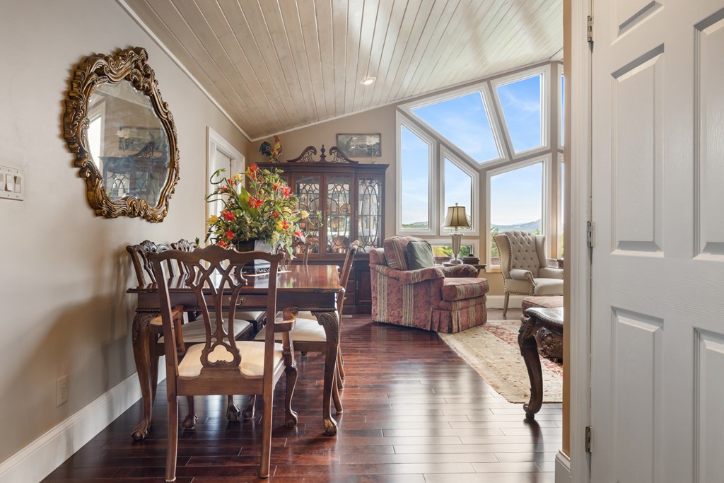 1396 Deerfield Road Young Harris, GA 30582 - Photo 17 of 60 a view of a dining room with furniture window and wooden floor