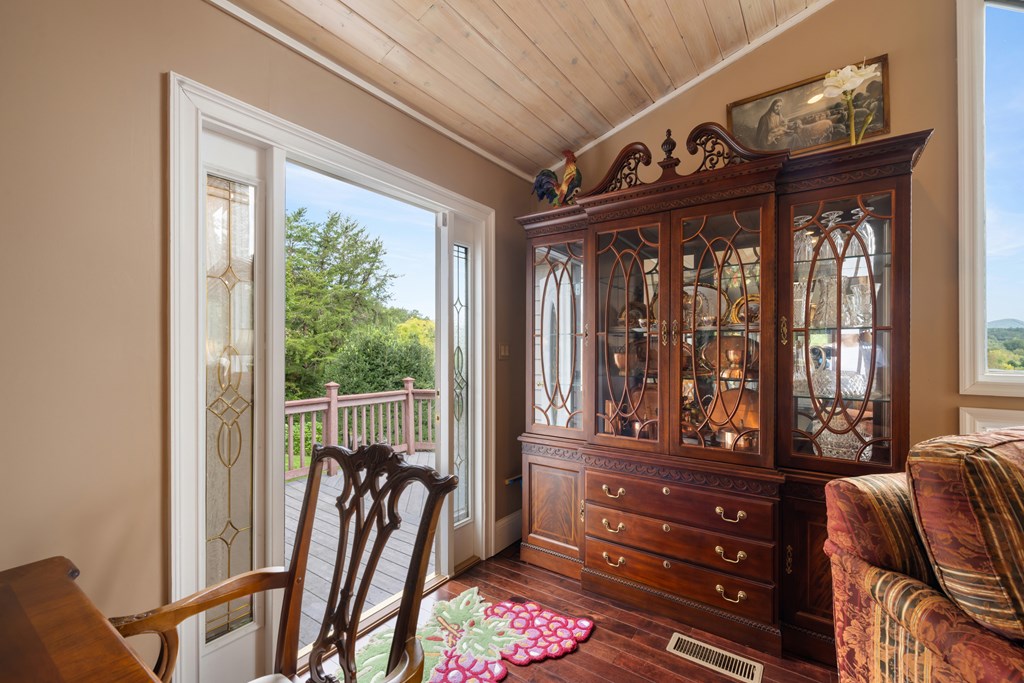1396 Deerfield Road Young Harris, GA 30582 - Photo 19 of 60 a view of a porch with furniture and front door