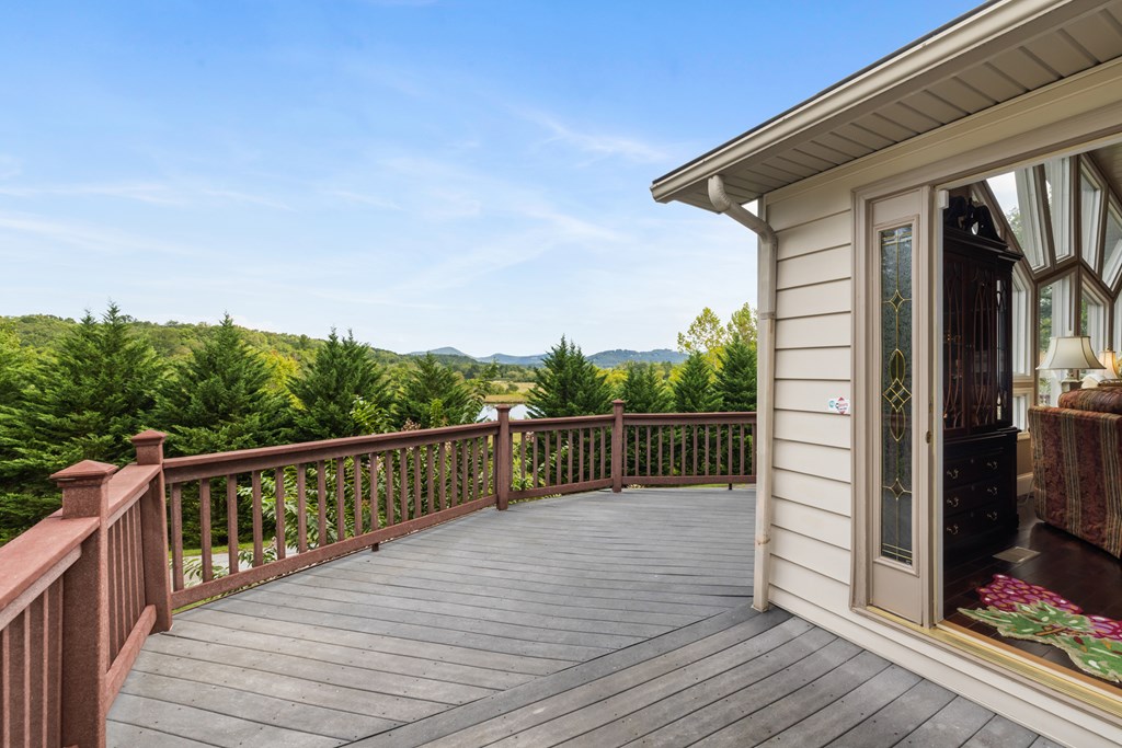 1396 Deerfield Road Young Harris, GA 30582 - Photo 21 of 60 a balcony with wooden floor