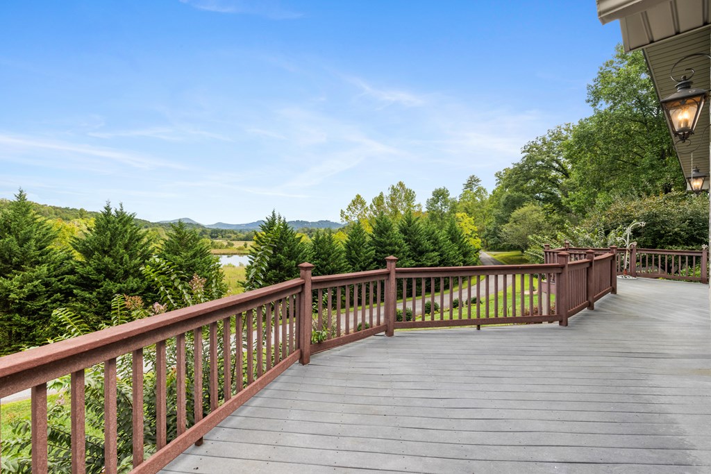 1396 Deerfield Road Young Harris, GA 30582 - Photo 22 of 60 a view of balcony with wooden floor and fence