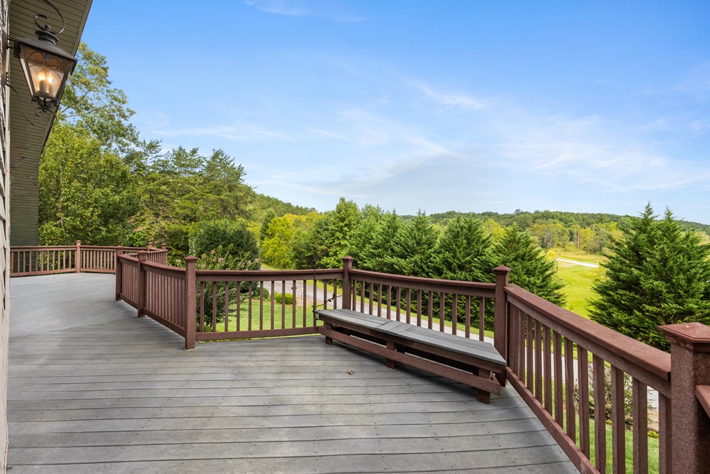 1396 Deerfield Road Young Harris, GA 30582 - Photo 23 of 60 a balcony with wooden floor and city view