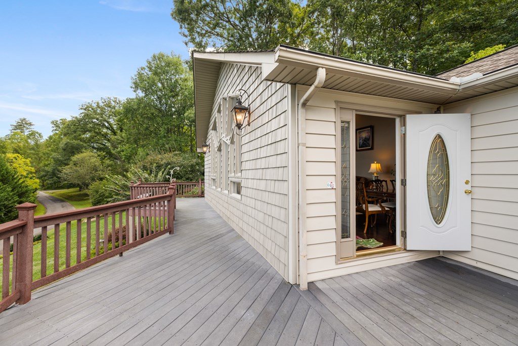 1396 Deerfield Road Young Harris, GA 30582 - Photo 27 of 60 a view of a house with a wooden deck