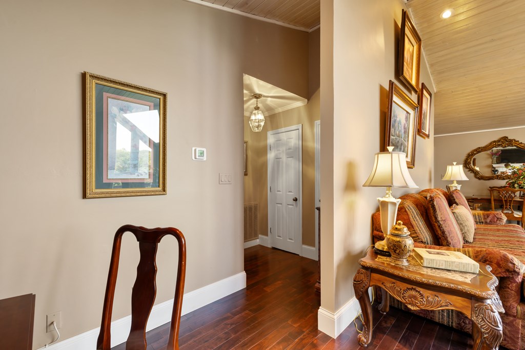 1396 Deerfield Road Young Harris, GA 30582 - Photo 29 of 60 a view of a bedroom with furniture and wooden floor
