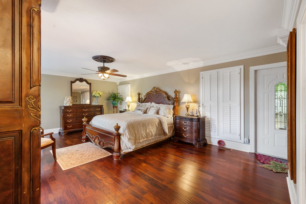 1396 Deerfield Road Young Harris, GA 30582 - Photo 31 of 60 a bedroom with a bed and a chandelier