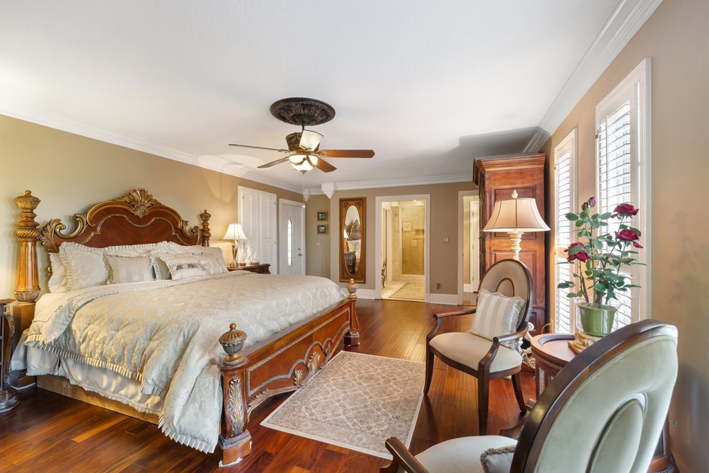 1396 Deerfield Road Young Harris, GA 30582 - Photo 33 of 60 a bed room with a bed and a chandelier