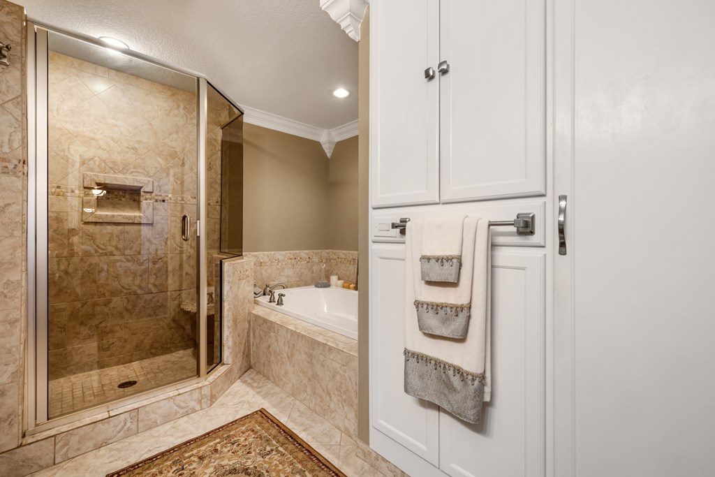 1396 Deerfield Road Young Harris, GA 30582 - Photo 35 of 60 a bathroom with a shower a mirror and a sink