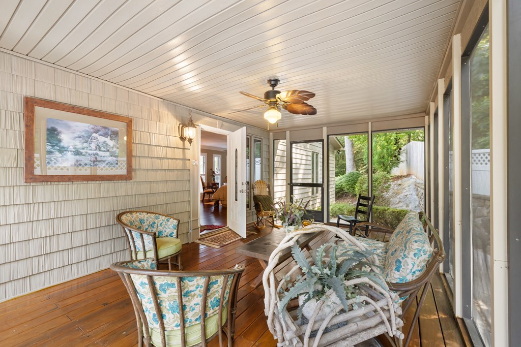 1396 Deerfield Road Young Harris, GA 30582 - Photo 40 of 60 a view of a dining room with furniture a chandelier and wooden floor