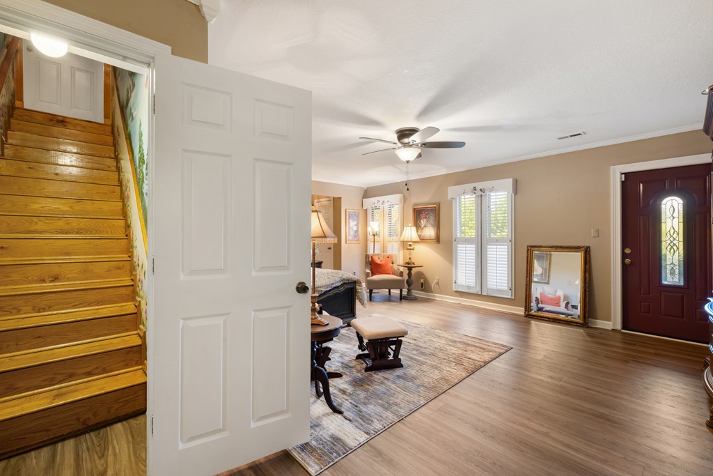 1396 Deerfield Road Young Harris, GA 30582 - Photo 43 of 60 a living room with furniture and wooden floor
