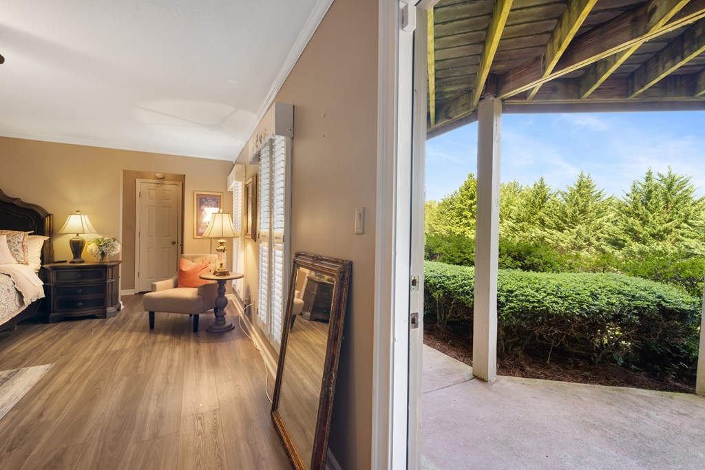 1396 Deerfield Road Young Harris, GA 30582 - Photo 45 of 60 a view of a balcony with furniture and wooden floor
