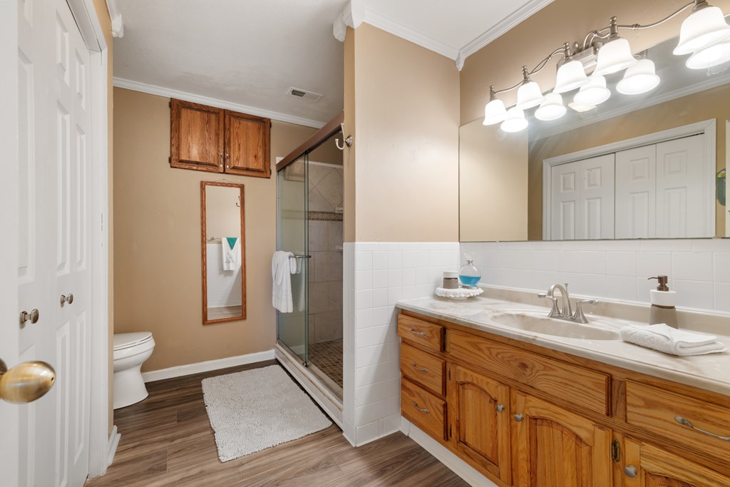 1396 Deerfield Road Young Harris, GA 30582 - Photo 50 of 60 a spacious bathroom with a sink a toilet and a mirror