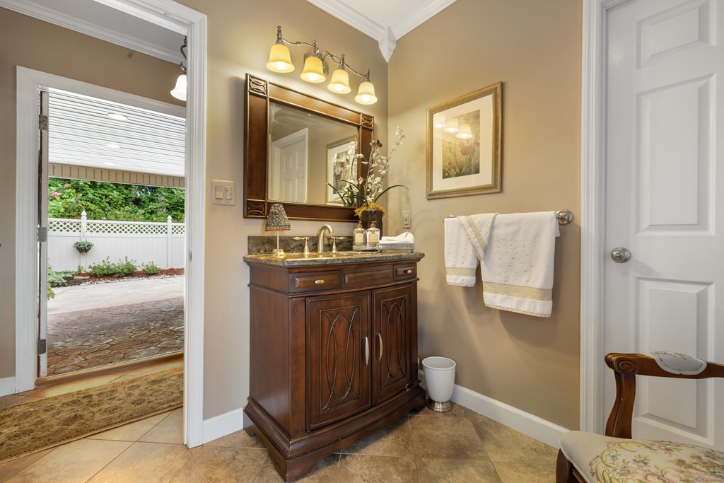 1396 Deerfield Road Young Harris, GA 30582 - Photo 53 of 60 a bathroom with a sink vanity and a mirror