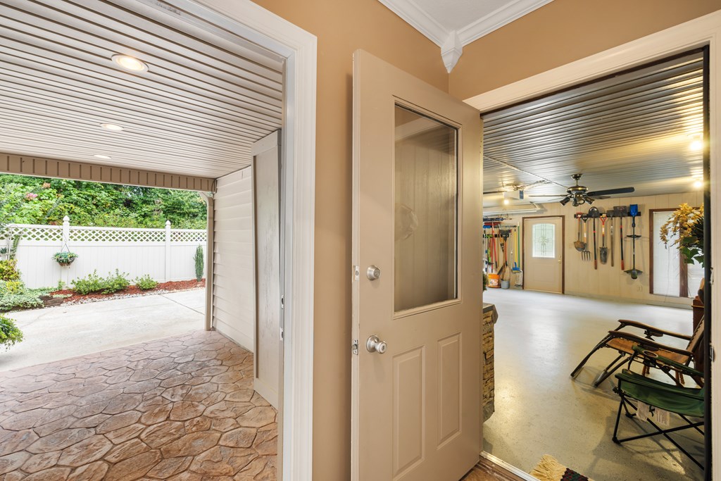 1396 Deerfield Road Young Harris, GA 30582 - Photo 55 of 60 a view of a hallway with a dining table and chairs