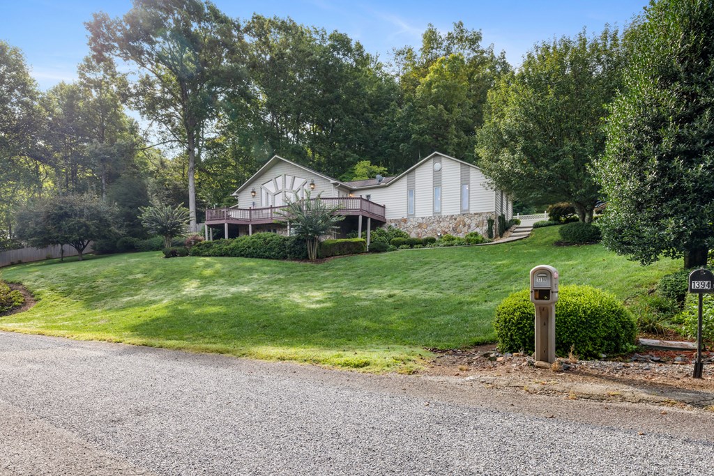 1396 Deerfield Road Young Harris, GA 30582 - Photo 56 of 60 a front view of a house with garden