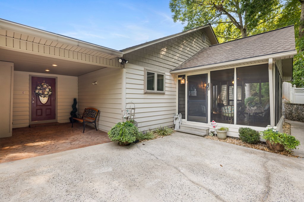 1396 Deerfield Road Young Harris, GA 30582 - Photo 7 of 60 a view of a house with entryway and a yard