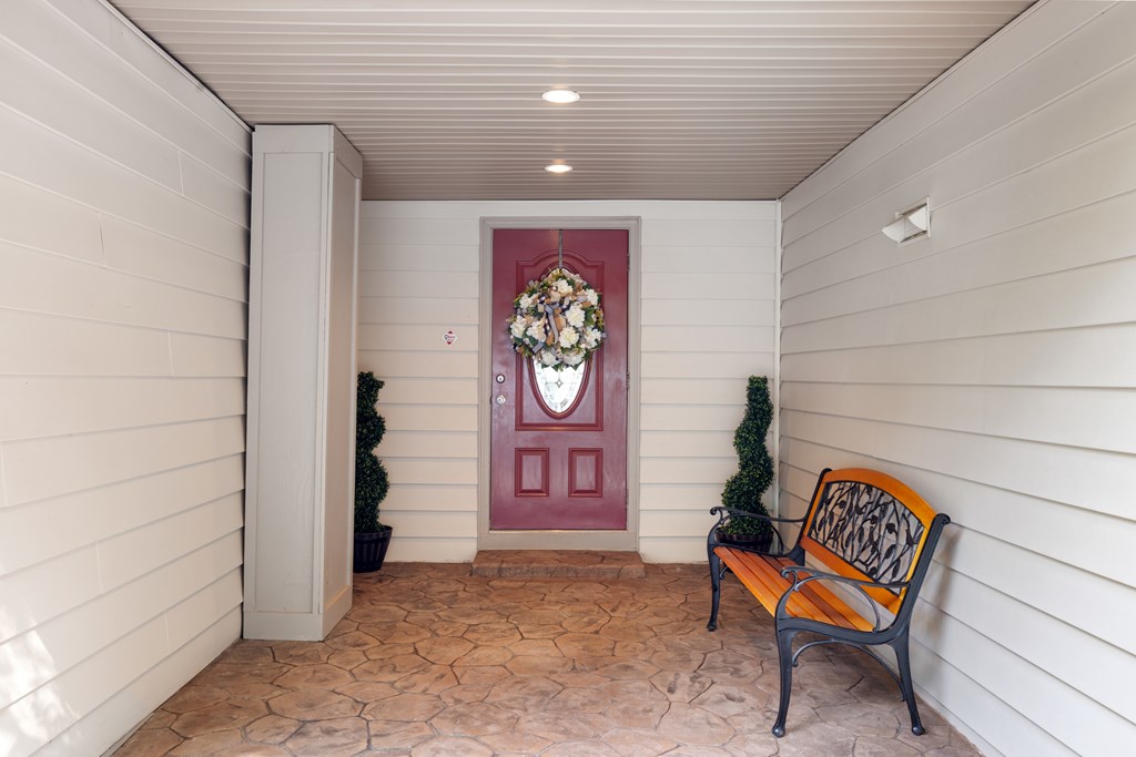 1396 Deerfield Road Young Harris, GA 30582 - Photo 8 of 60 a bench sitting in a hall with wooden walls