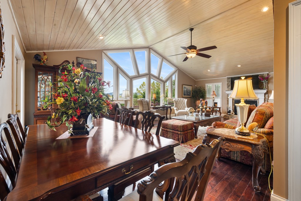 1396 Deerfield Road Young Harris, GA 30582 - Photo 9 of 60 a view of a dining room with furniture and wooden floor