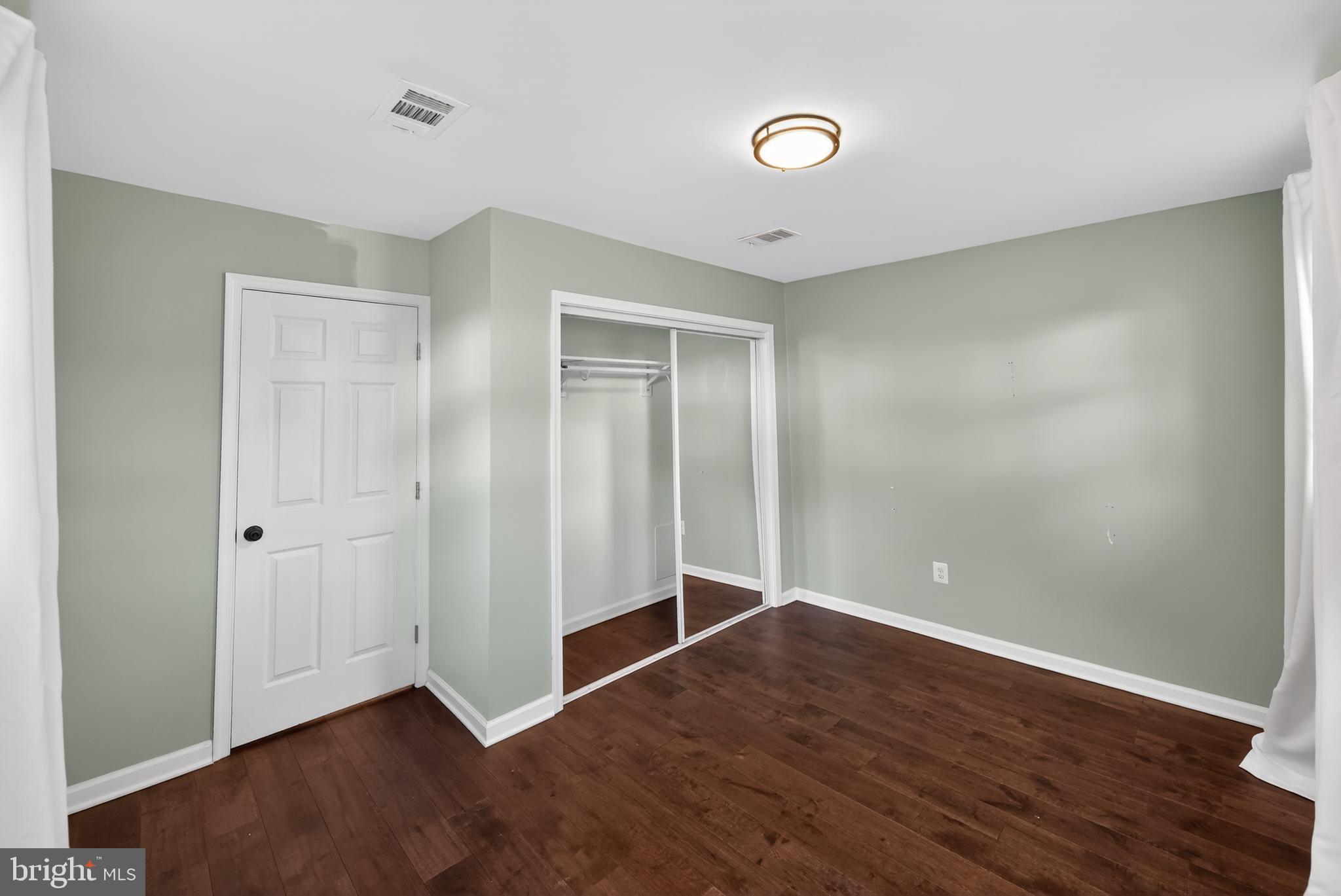 3670 5th Avenue Edgewater, MD 21037 - Photo 28 of 60 a view of an empty room with wooden floor