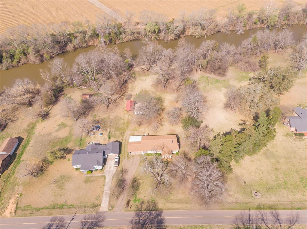 13040 Adger Road Gilliam, LA 71029 - Photo 2 of 29 an aerial view of house with yard and mountain view